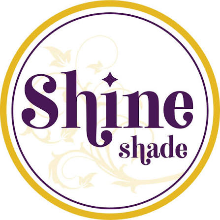 Shine Over Shade logo featuring the words "Shine Shade" in purple lettering inside a golden circle.